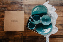 Load image into Gallery viewer, Turquoise pottery in a brown gift box seen from above on a wooden table
