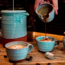Load image into Gallery viewer, 2 turquoise espresso cups with ice cream in them, espresso coffee being poured into one of the espresso cups from a mini jug with a turquoise coffee pot in the back ground