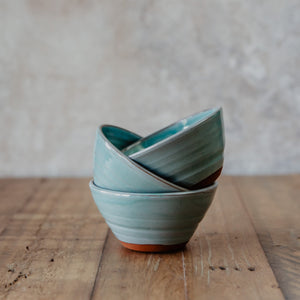 3 stacked turquoise bowls