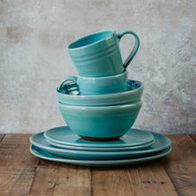 Load image into Gallery viewer, Stack of turquoise pottery pieces
