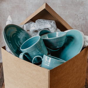 Turquoise pottery in a brown gift box