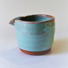 Load image into Gallery viewer, Mini turquoise milk jug with no handle, side view on a white back ground.
