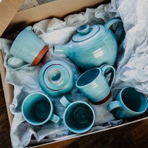 Turquoise tea set in a gift box with white tissue